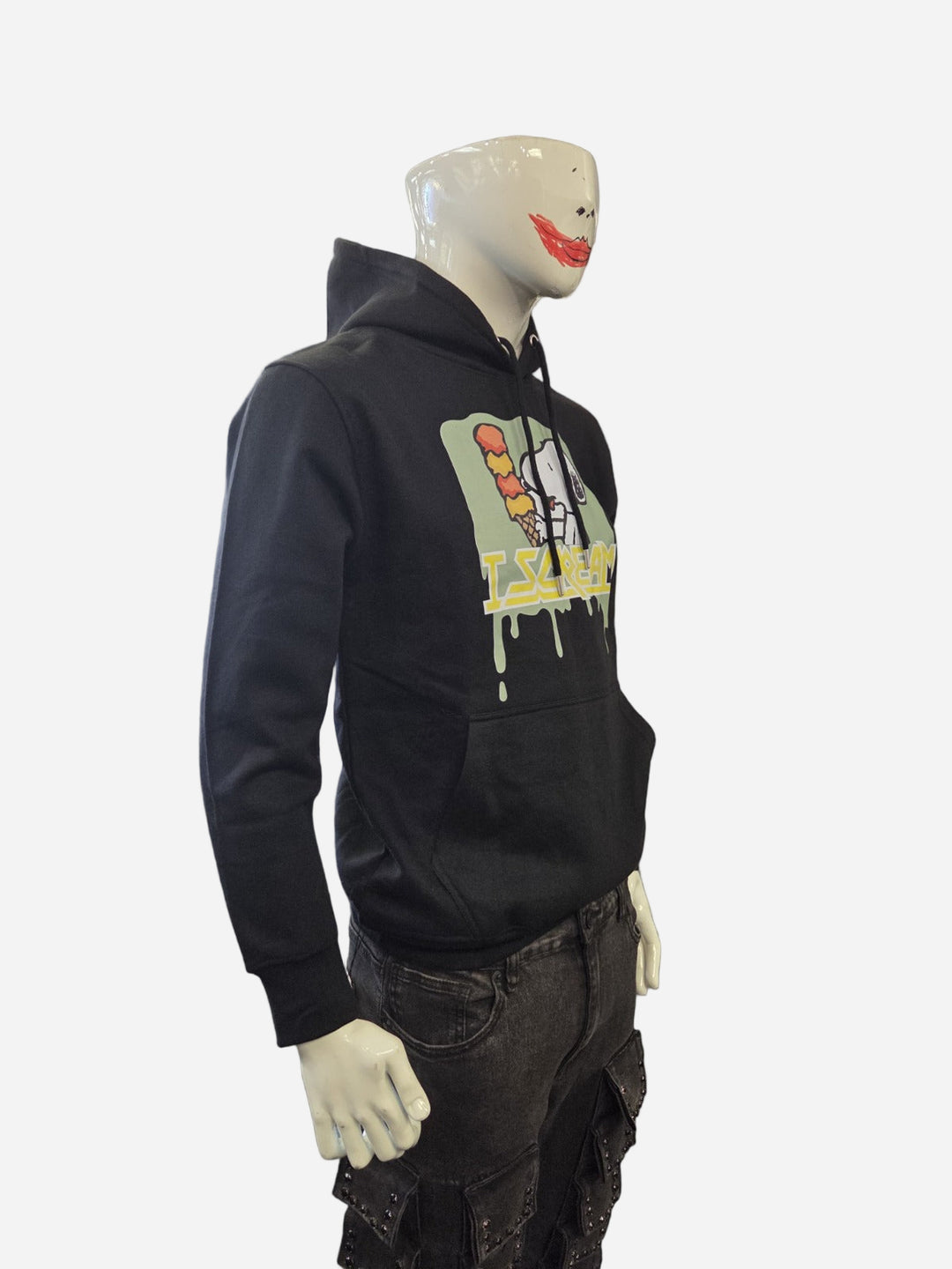 Mannequin wearing a black hoodie with a graphic design on a gray background