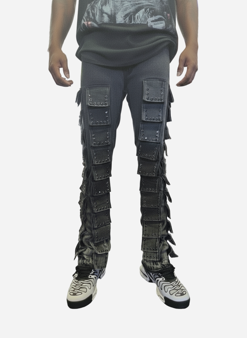 Person wearing dark gray pants with unique design elements on a white background