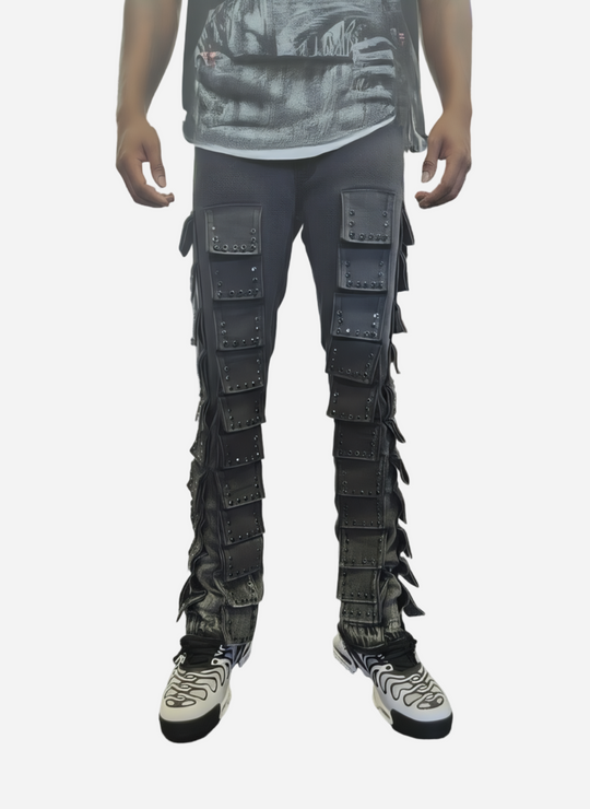 Person wearing a unique black pants with layered design in a store setting.